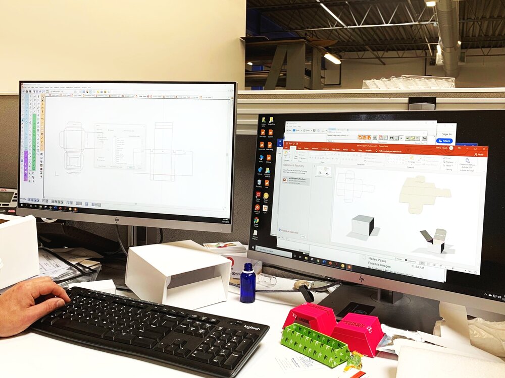 Person at a computer with packaging CAD designs on screen
