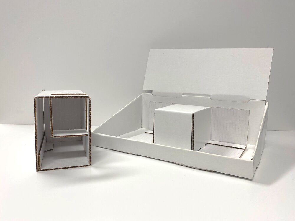 Packaging prototypes on a desk.